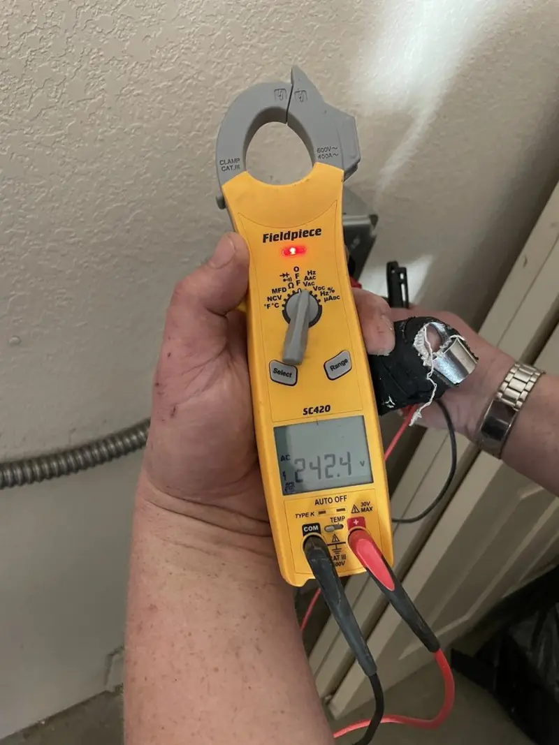Voltage testing with clamp meter during Generator Installation in Casselberry